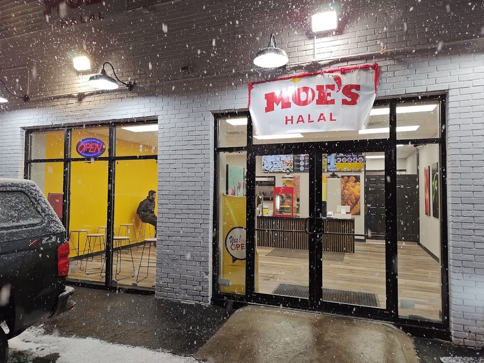 Halal cart counter with wrapped sandwiches and fries