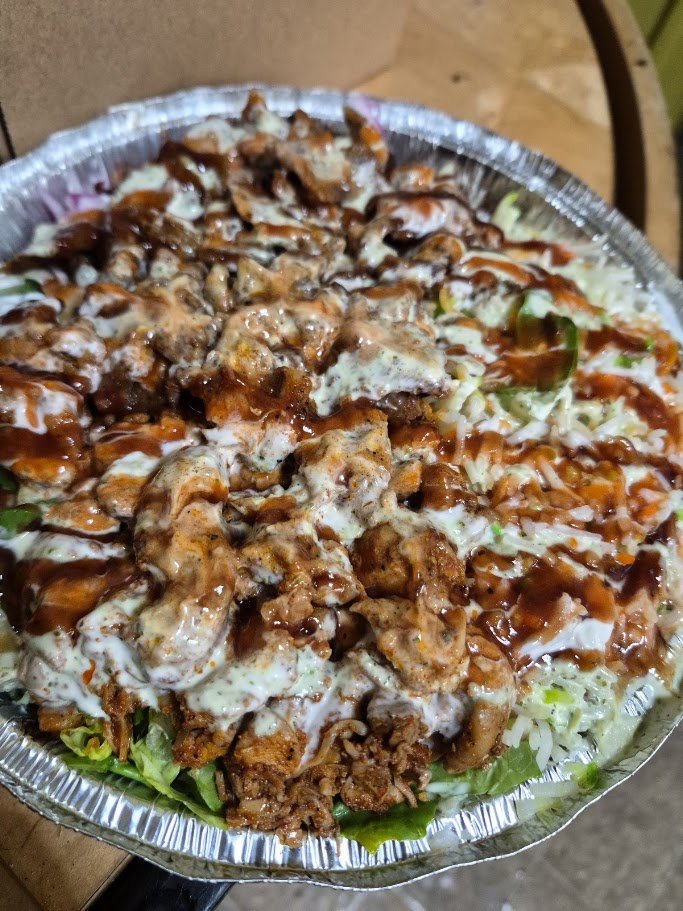 Halal cart counter with wrapped sandwiches and fries